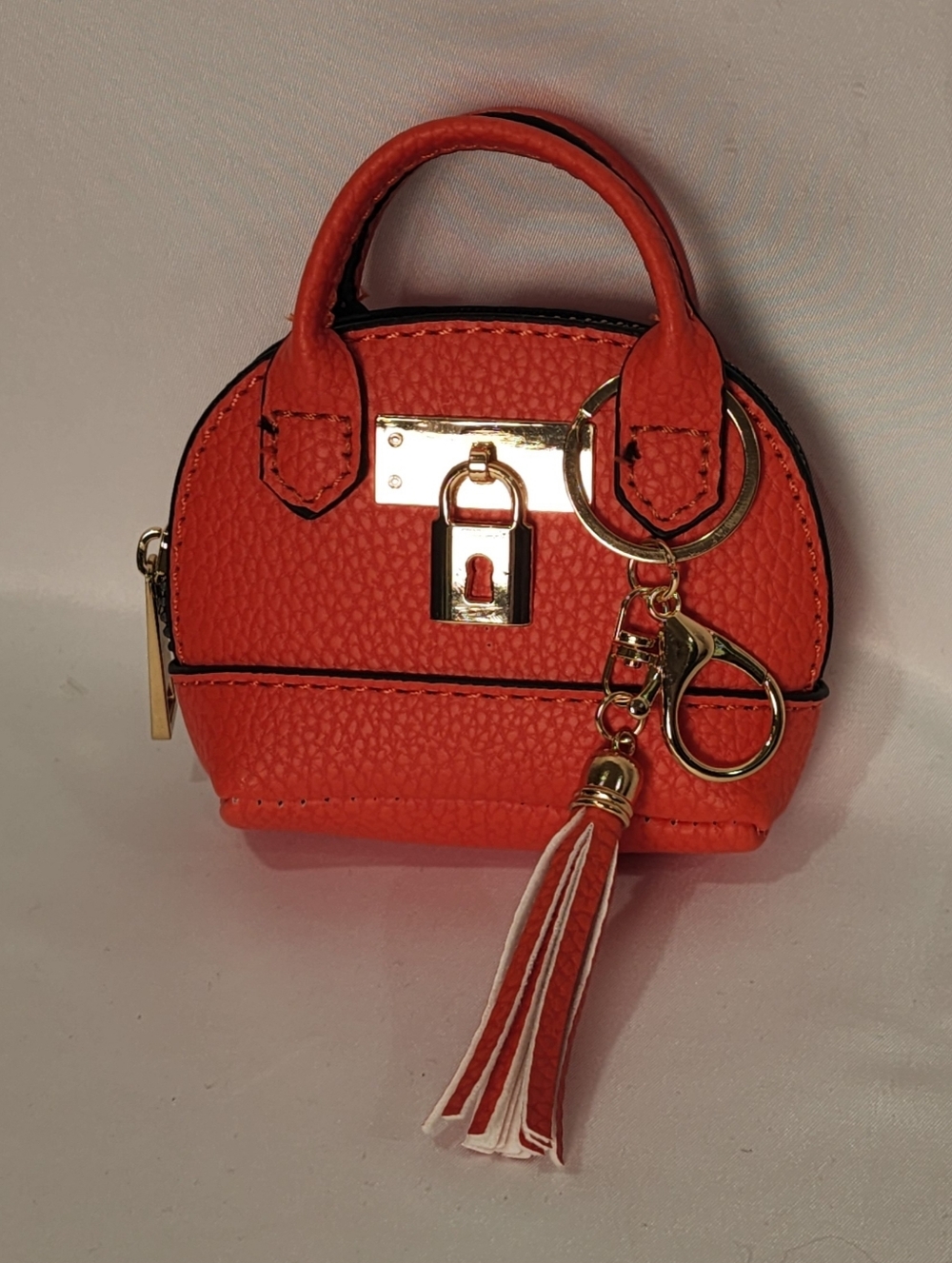 Mini Orange Leather Dome Crossbody Bag with Gold Lock